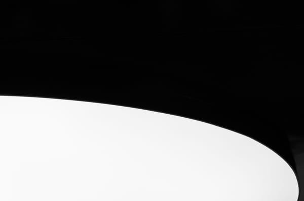 a black and white graphic image of almost half black and half white